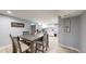 Basement dining area featuring a gray table and chairs and light wood flooring at 8438 Ames St, Arvada, CO 80003