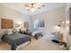Inviting bedroom with two twin beds, stylish decor, a cozy chair, and a bright window at 415 Butte Pkwy, Golden, CO 80403