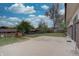 Spacious backyard with concrete patio and mature trees at 9584 W Kentucky Ave, Lakewood, CO 80226