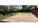 Back exterior view of a brick home with a concrete patio and grassy yard at 9584 W Kentucky Ave, Lakewood, CO 80226