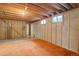 Unfinished basement featuring concrete floors and walls, as well as exposed pipes and beams at 9584 W Kentucky Ave, Lakewood, CO 80226