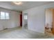 Bright bedroom with a mirrored closet and view into the en-suite bathroom at 9584 W Kentucky Ave, Lakewood, CO 80226