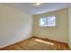 Modest bedroom with neutral carpet and a single window offering natural light at 9584 W Kentucky Ave, Lakewood, CO 80226