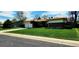 Charming single-story home featuring a two-car garage and a well-maintained front yard with a long driveway at 9584 W Kentucky Ave, Lakewood, CO 80226