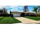 Charming single-story home featuring a two-car garage and a well-maintained front yard with a long driveway at 9584 W Kentucky Ave, Lakewood, CO 80226