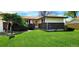 Charming single-story home with a well-manicured lawn, brick accents, and an inviting entrance at 9584 W Kentucky Ave, Lakewood, CO 80226