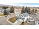 Aerial view of the property showcasing its location, landscaping, and proximity to neighborhood amenities at 11997 W Coal Mine Dr, Littleton, CO 80127