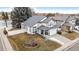 Aerial view of a two-story home with a well-maintained lawn and mature trees at 11997 W Coal Mine Dr, Littleton, CO 80127