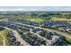Aerial view of a neighborhood showcasing beautiful houses and stunning mountain scenery at 6616 Amur Ln, Castle Rock, CO 80108