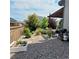 Landscaped backyard featuring a grill, vegetation, and a pergola with outdoor seating at 6616 Amur Ln, Castle Rock, CO 80108