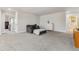 Spacious basement with cozy seating and neutral décor for versatile use at 6616 Amur Ln, Castle Rock, CO 80108