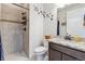 Well-lit bathroom showcasing a tiled shower, modern fixtures, and a stylish vanity area at 6616 Amur Ln, Castle Rock, CO 80108
