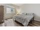 Clean bedroom with a bed, a window, and wooden floor, offering comfort and simplicity at 6616 Amur Ln, Castle Rock, CO 80108