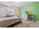Basement bedroom with a large window, carpeted floors, neutral walls, and standard furnishings at 6616 Amur Ln, Castle Rock, CO 80108