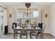 Bright dining room with a decorative chandelier and backyard view at 6616 Amur Ln, Castle Rock, CO 80108
