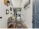 Inviting entryway with wood floors, a stylish bench, and decorative wall accents at 6616 Amur Ln, Castle Rock, CO 80108