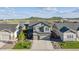 Exterior of two-story home featuring three-car garage, manicured front yard and mountain views at 6616 Amur Ln, Castle Rock, CO 80108