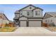 Charming two-story home with a two car garage and a well-maintained front yard at 6616 Amur Ln, Castle Rock, CO 80108
