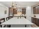 Kitchen with a large island, stainless steel appliances, and modern lighting at 6616 Amur Ln, Castle Rock, CO 80108