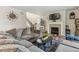 Inviting living room with a comfortable couch, fireplace, and stylish decor, perfect for relaxation at 6616 Amur Ln, Castle Rock, CO 80108