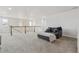 Spacious living room featuring plush seating, soft carpeting, and an open layout at 6616 Amur Ln, Castle Rock, CO 80108