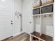 Organized mud room with built-in storage, coat hooks, and a convenient bench at 6616 Amur Ln, Castle Rock, CO 80108