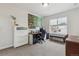 Bright office featuring a large desk, ample storage, and a comfortable seating area near the window at 6616 Amur Ln, Castle Rock, CO 80108