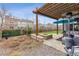 Outdoor patio with a pergola, fire pit, and a seating area, perfect for entertaining at 6616 Amur Ln, Castle Rock, CO 80108