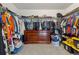 Spacious walk-in closet with ample storage, shelving, and clothes racks for organization at 6616 Amur Ln, Castle Rock, CO 80108