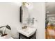 Updated bathroom with white pedestal sink and gold fixtures at 36 N Emerson St # 203, Denver, CO 80218
