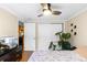 Bright bedroom with double doors leading to a spacious closet and a view into the kitchen at 36 N Emerson St # 203, Denver, CO 80218