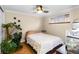 Cozy bedroom with a large plant and a queen-size bed at 36 N Emerson St # 203, Denver, CO 80218