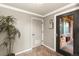 Building entryway with intercom system and brick exterior visible through the glass door at 36 N Emerson St # 203, Denver, CO 80218