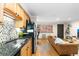 Open concept kitchen and living area with modern furnishings at 36 N Emerson St # 203, Denver, CO 80218