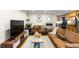 Spacious living room with a large TV and comfortable seating at 36 N Emerson St # 203, Denver, CO 80218