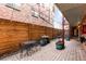 Private patio with brick paving, bistro table and chairs, and a small water fountain at 36 N Emerson St # 203, Denver, CO 80218