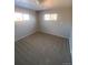 Bright bedroom with neutral walls and carpet at 1240 Russell Blvd, Thornton, CO 80229