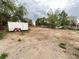 Large backyard offering a blank canvas for outdoor activities and creative landscaping at 7115 Harold St # 2, Fort Lupton, CO 80621