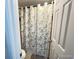 Bathroom showcasing a toilet and stylish shower curtain at 7115 Harold St # 2, Fort Lupton, CO 80621