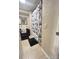 Bathroom features tiled floors, a dark vanity and a shower with a marble-patterned curtain at 7115 Harold St # 2, Fort Lupton, CO 80621