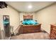 Carpeted bedroom with a wood bed frame, a mirror and light walls at 7115 Harold St # 2, Fort Lupton, CO 80621