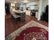 Modern kitchen with granite countertops, stainless steel appliances and island with barstool seating at 7115 Harold St # 2, Fort Lupton, CO 80621
