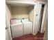 Convenient laundry area with washer and dryer hookups with storage space at 7115 Harold St # 2, Fort Lupton, CO 80621