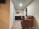 Cozy living room featuring a comfortable armchair, perfect for relaxation and reading at 7115 Harold St # 2, Fort Lupton, CO 80621