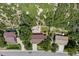 Aerial view of a neighborhood featuring mature trees and lush landscaping in a suburban community at 452 Gordon Dr, Castle Rock, CO 80104