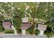 Aerial view of a residential property surrounded by lush greenery and trees in a suburban neighborhood at 452 Gordon Dr, Castle Rock, CO 80104