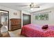 Bedroom showcasing closet space, dresser, and a bright window with views of the outdoor greenery at 452 Gordon Dr, Castle Rock, CO 80104