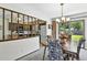 Charming dining area with views to kitchen, features a chandelier and a sliding glass door at 452 Gordon Dr, Castle Rock, CO 80104
