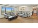 Bright living room with comfortable seating, large windows offering scenic views, and a staircase at 452 Gordon Dr, Castle Rock, CO 80104