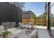 Outdoor dining and seating create a cozy backyard, ideal for enjoying the outdoors at 716 S Race St, Denver, CO 80209
